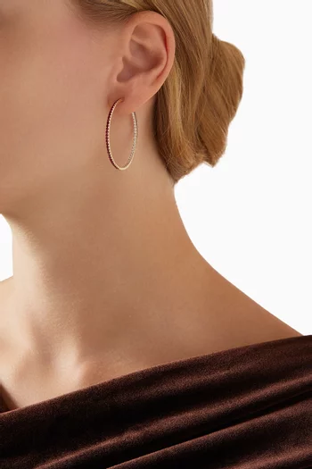 أقراط دائرية كبيرة مرصعة بياقوت وماس ذهب عيار 18