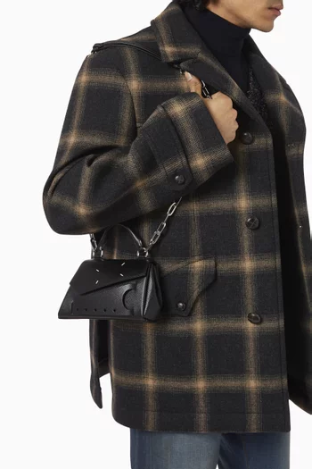 Snatched Asymmetric Micro Handbag in Leather