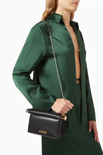 La Petite Pochette Rond Clutch Bag in Leather