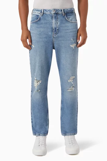 Distressed Tapered Jeans in Denim