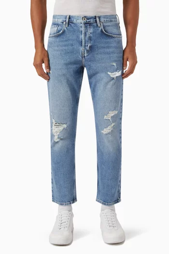 Distressed Tapered Jeans in Denim
