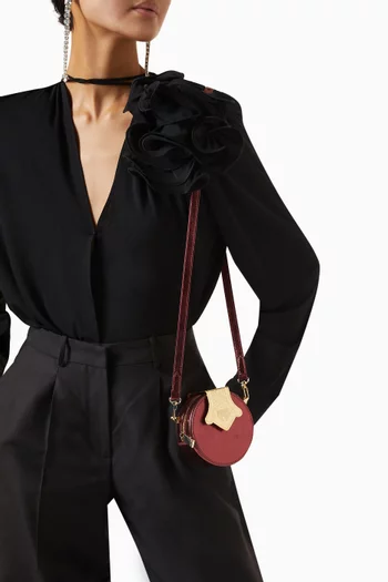 Micro Dome Embossed Crossbody Bag in Leather