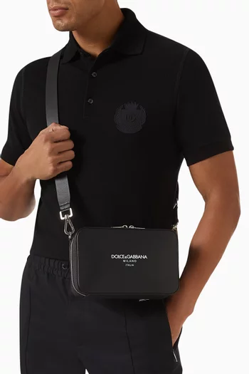 Logo-embossed Messenger Bag in Leather