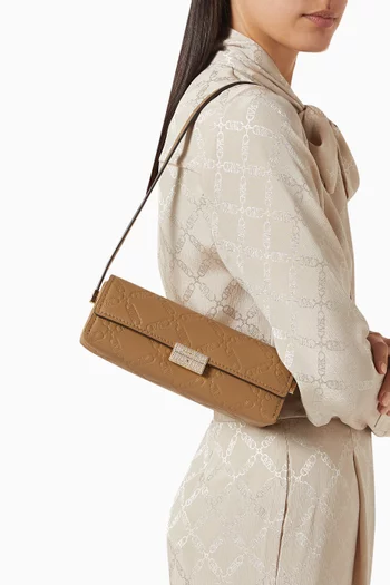Small Ludlow Pochette in Monogram-embossed Leather
