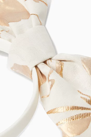 طوق رأس مزين بعقدة بتصميم أوريغامي