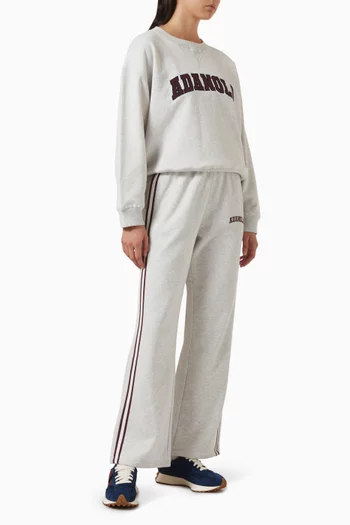 سويت شيرت بقصة فضفاضة وتصميم جامعي قطن عضوي