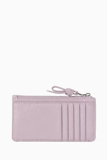 حافظة بطاقات لوب إيست/ويست بسحّاب جلد لامع