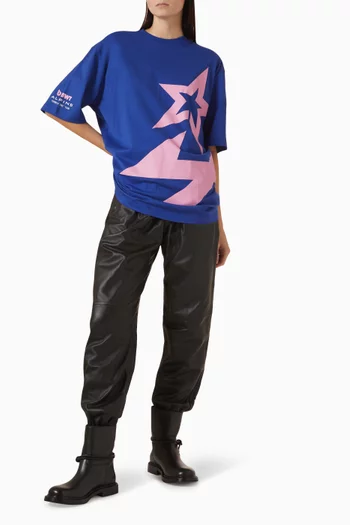 تي شيرت بقصة فضفاضة وطبعة شعار الماركة قطن