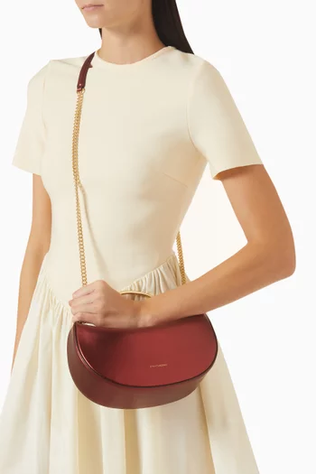 حقيبة  ميني بتصيمي هلال جلد لامع