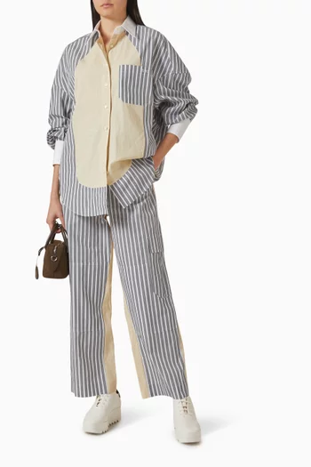 قميص بقصة فضفاضة وخطوط بألوان مغايرة