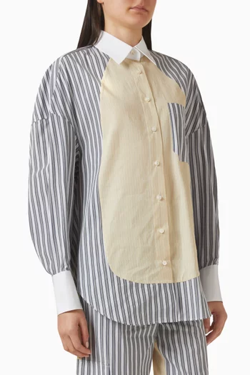 قميص بقصة فضفاضة وخطوط بألوان مغايرة