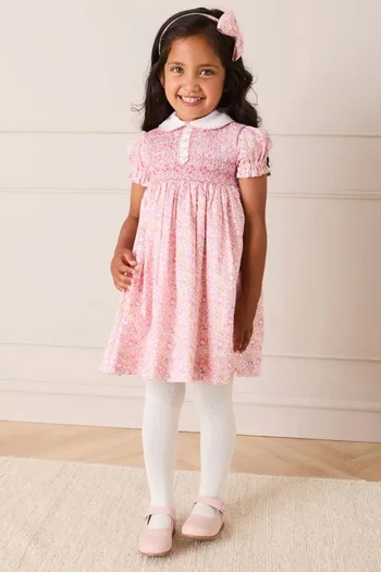 فستان نيلي بنقشة زهور وكشكش يدوي