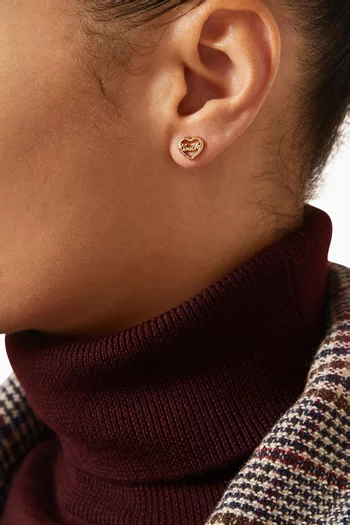 أقراط بتصميم قلب مزينة بشعار الماركة نحاس مطلي