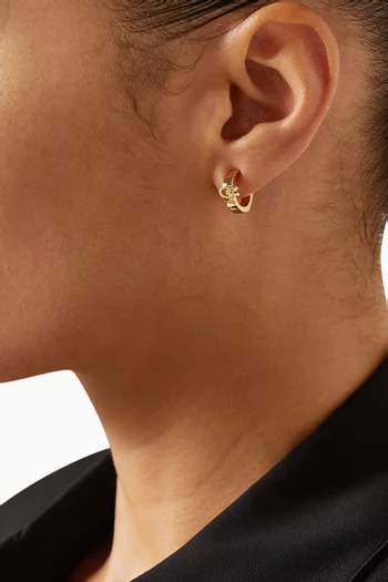 Signature C Huggie Earrings in Plated Brass