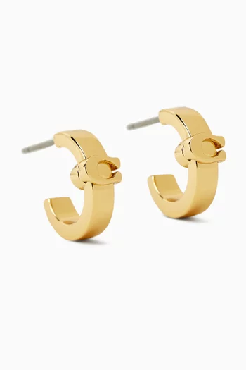 Signature C Huggie Earrings in Plated Brass