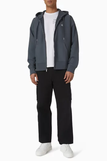 كنزة فضفاضة بغطاء رأس وسحّاب تيري