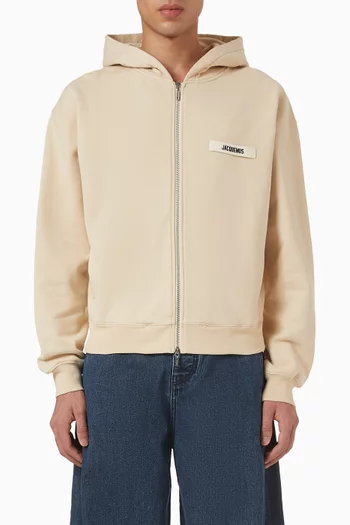 كنزة بغطاء رأس وسحّاب بشريط مضلع بشعار الماركة قطن عضوي