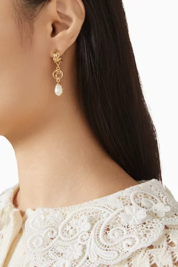 أقراط متدلية مزينة بلؤلؤ نحاس