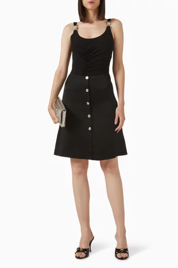 تنورة بأزرار بشعار ميدوسا ستان