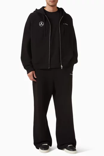 كنزة بغطاء رأس وسحّاب وشعار الماركة صوف قطني