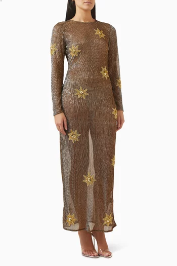 فستان طويل بتطريزات شموس