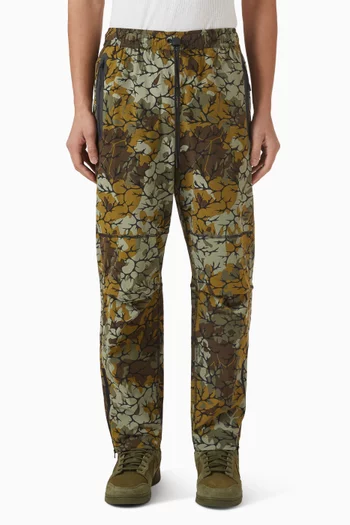 بنطال تيك بحواف مفتوحة ومعالج بتقنية Dri-FIT قماش منسوج