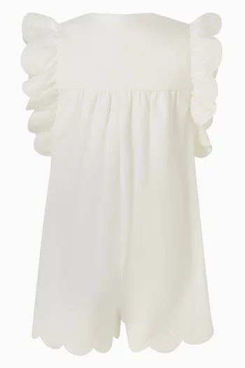 رومبر بتصميم بلا أكمام وكشكش وأزرار