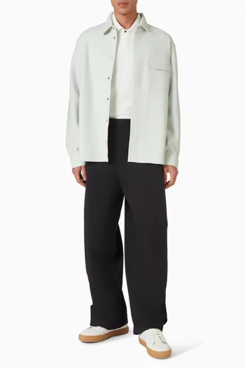 بنطال قطن بقصة ساق واسعة وطيّات