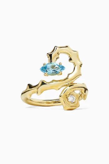 خاتم بتصميم ملفوف مرصع بالماس وحجر توباز