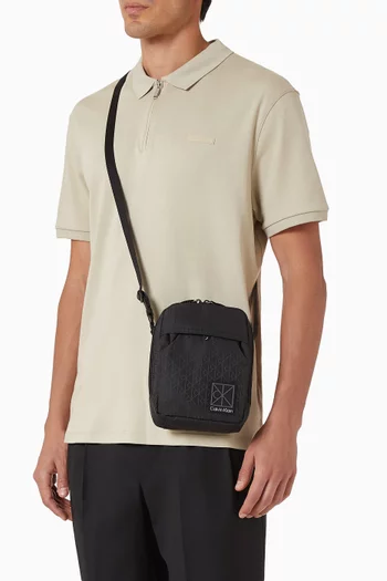 Utility Emblem Reporter Crossbody Bag in Coated Canvas