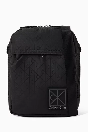 Utility Emblem Reporter Crossbody Bag in Coated Canvas