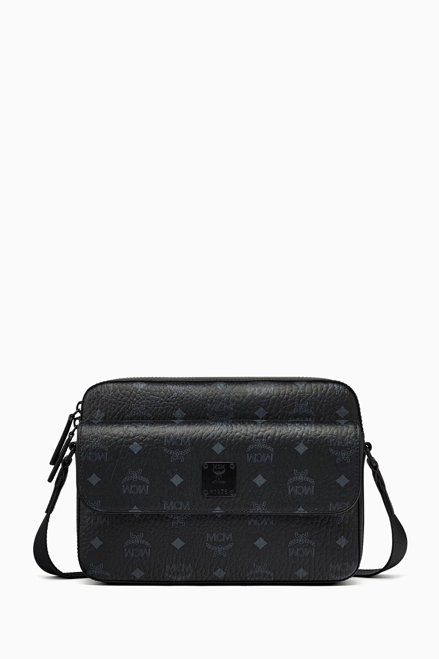 Black mcm wristlet 2025